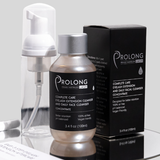 Prolong Lash cleanser concentrate with foaming bottle pump, retail packaging, and cleansing brush displayed on a reflective surface.
