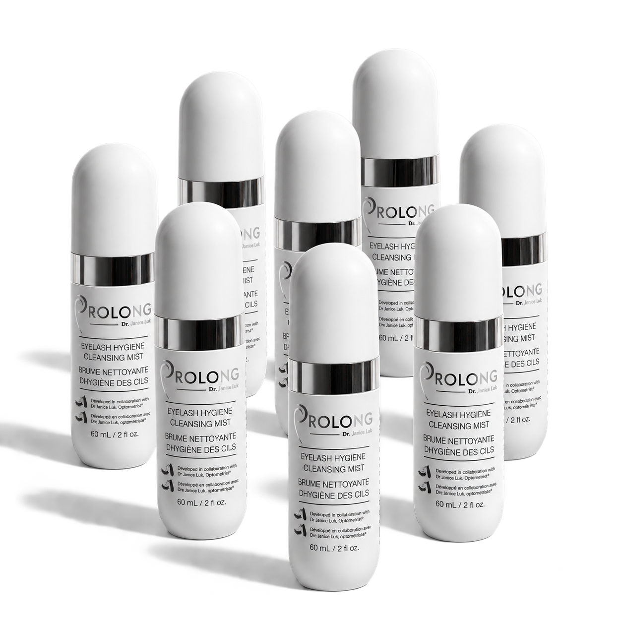A group of white cylindrical bottles of Prolong Eyelash Hygiene Cleansing Mist with silver caps, arranged on a clean white background.