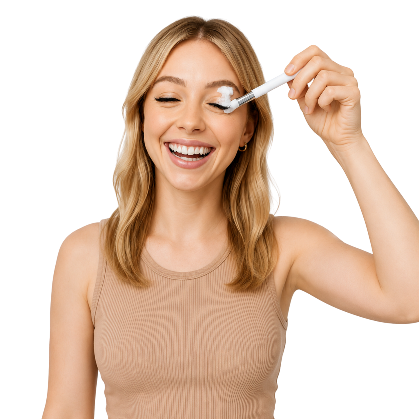 A woman with blonde hair smiling while using a white eyelash cleansing brush on her eye, wearing a beige ribbed tank top against a solid white background.